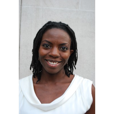 Picture of Nathalie Richards, a smiling Black woman with black hair wearing a white t shirt.