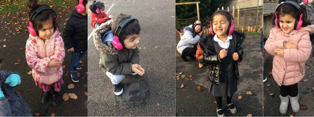 Four children enjoy using Now Press Play outdoors at Marshfield School
