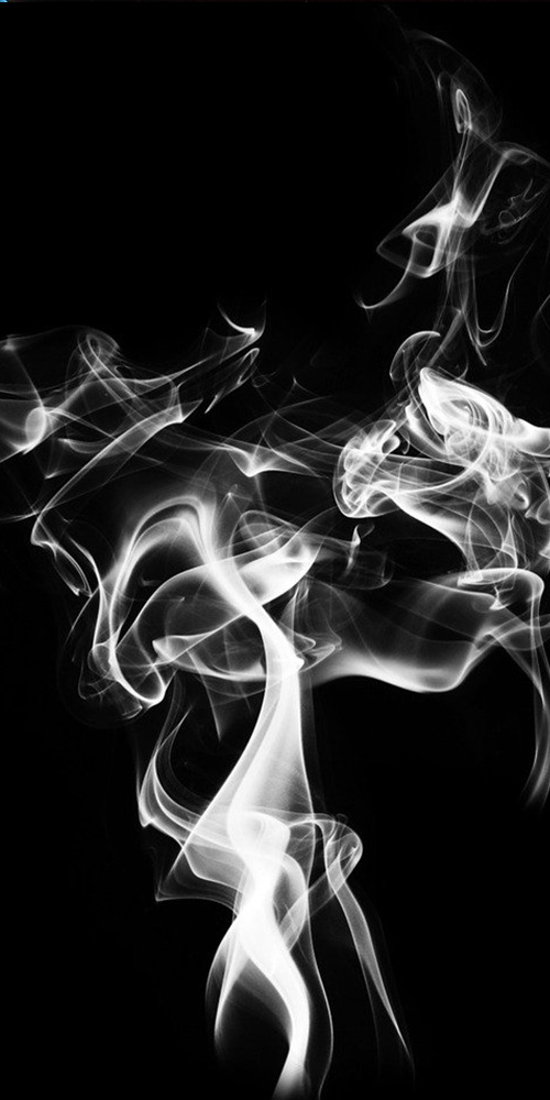 White smoke in front of a black background.