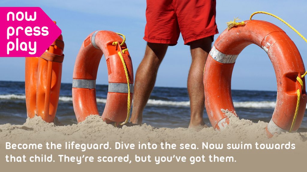 A lifeguard stands on a beach, with life rings in the sand by their feet. Text reads: Become the lifeguard. Dive into the sea. Now swim towards that child. They're scared, but you've got them.