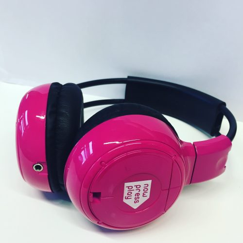 Picture of a pair of pink Now Press Play headphones.