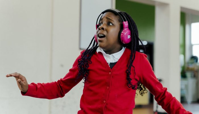 A girl looks worried while immersed in a Now Press Play sensory learning Experience