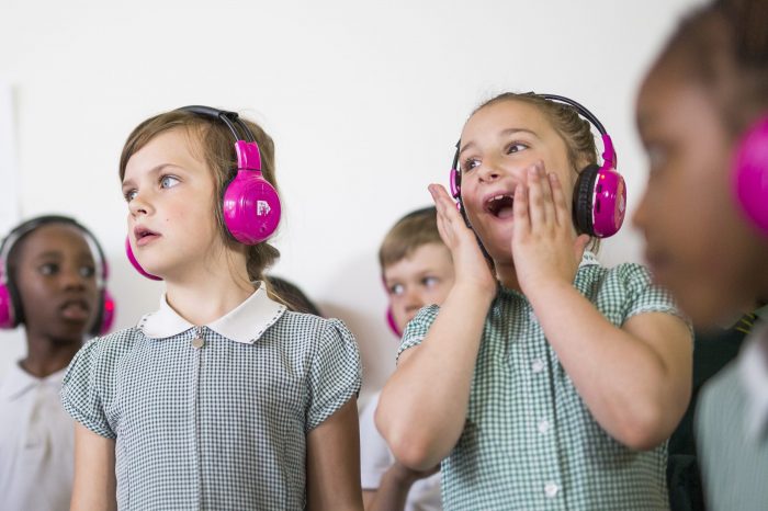 Children look shocked while using Now Press Play
