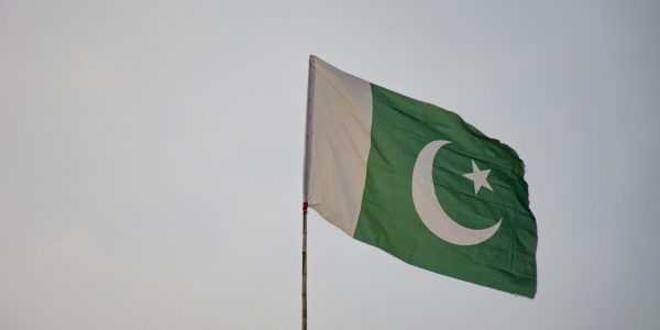 The green and white Pakistan flag flying from a flagpole