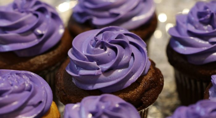 Close up picture of some purple cupcakes