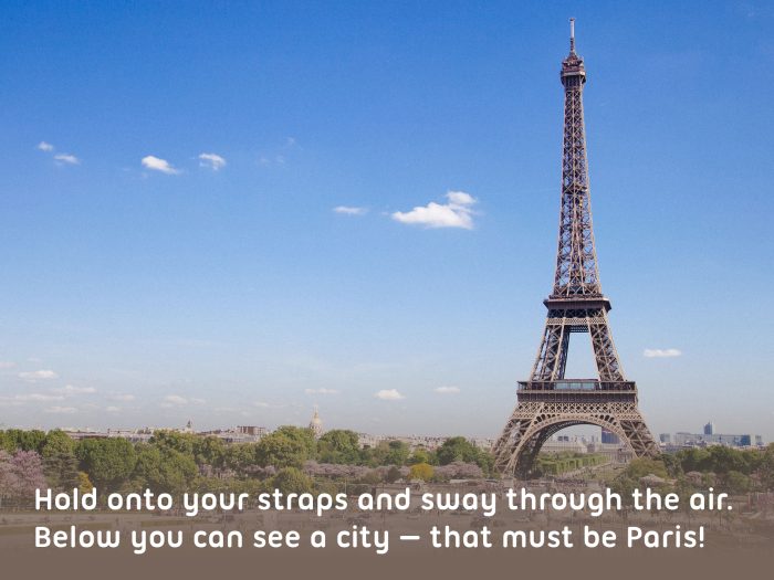 A view of the Eiffel Tower in Paris, against a blue sky