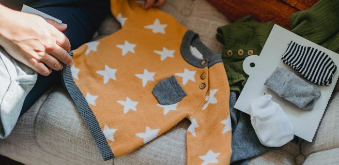 Picture of a person sorting children's laundry